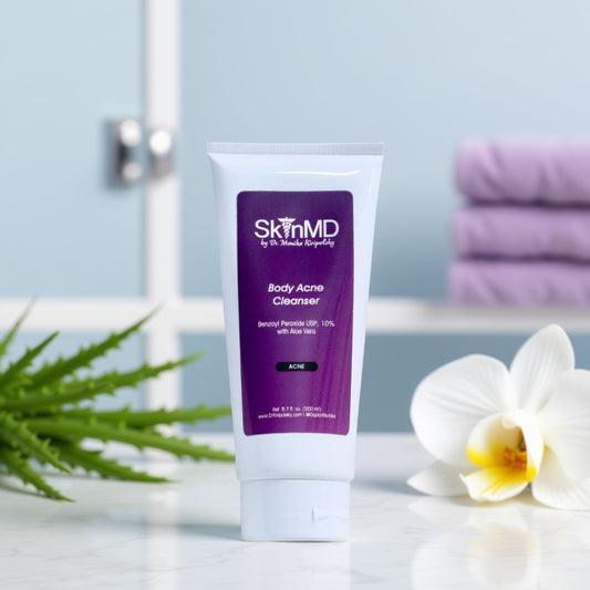 Tube of SkinMD Body Acne Cleanser on a bathroom counter with flowers and towels in the background.